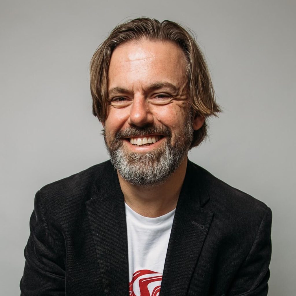 A lush portrait of David McGuire from Windhover B2B Copywriting. He's all smiley and friendly, just like in real life.