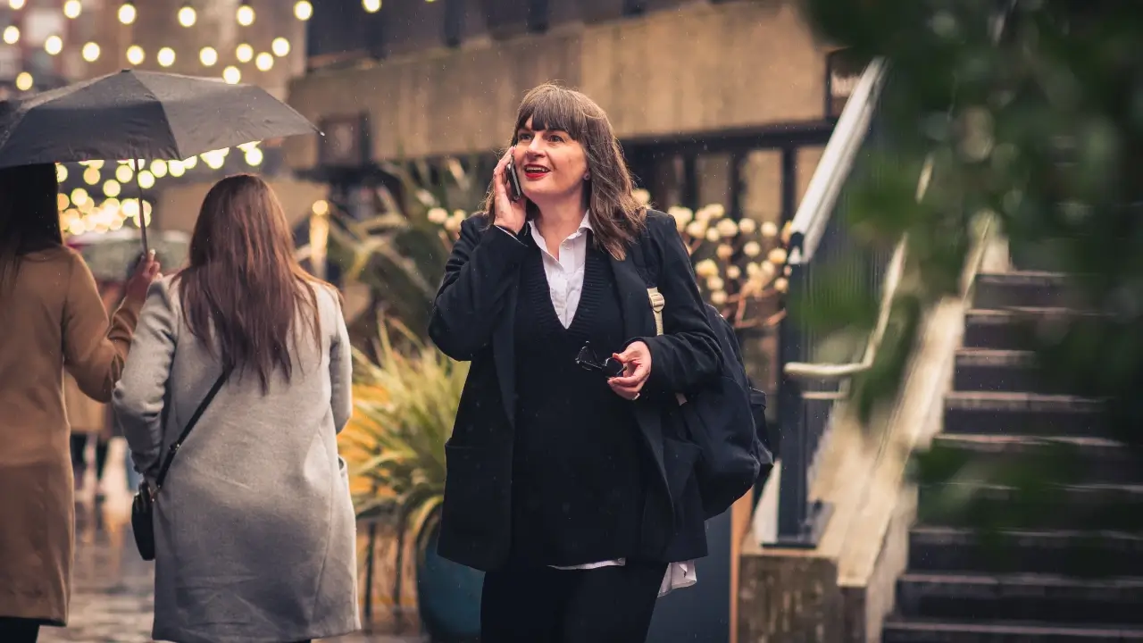 Katherine of Haydn Grey Copywriting walking along while on the phone